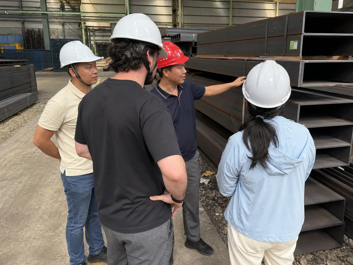 Customer and RLB Steel staff reviewing structural steel products