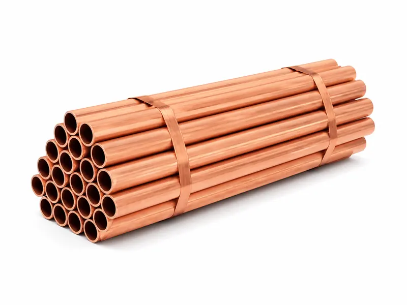 Bundle of straight hollow copper tubes on a white background