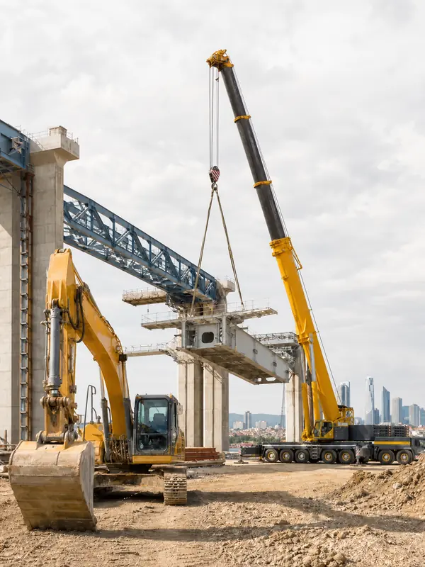 Construction machinery and steel lifting equipment at a major infrastructure project